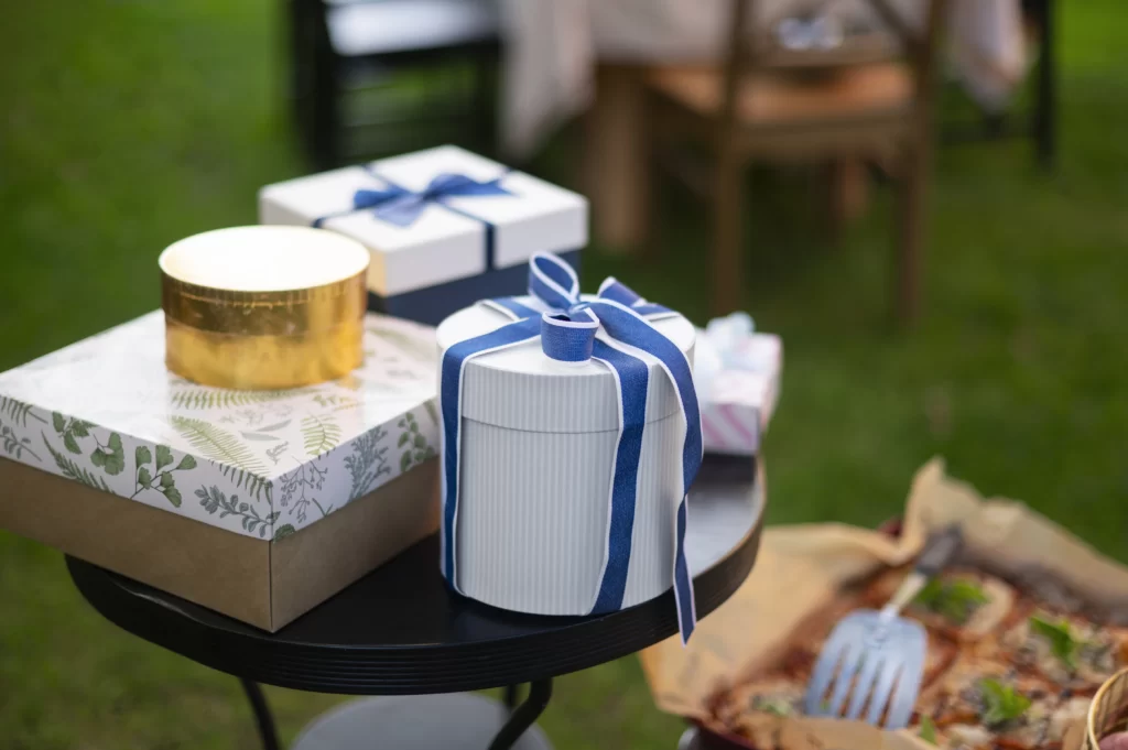 Personalized gift collection for in-laws including engraved jewelry, custom photo albums, and monogrammed wallet.