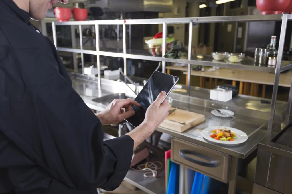 Catering Trends - A digital menu interface on a tablet used for personalized catering orders in a modern event setting