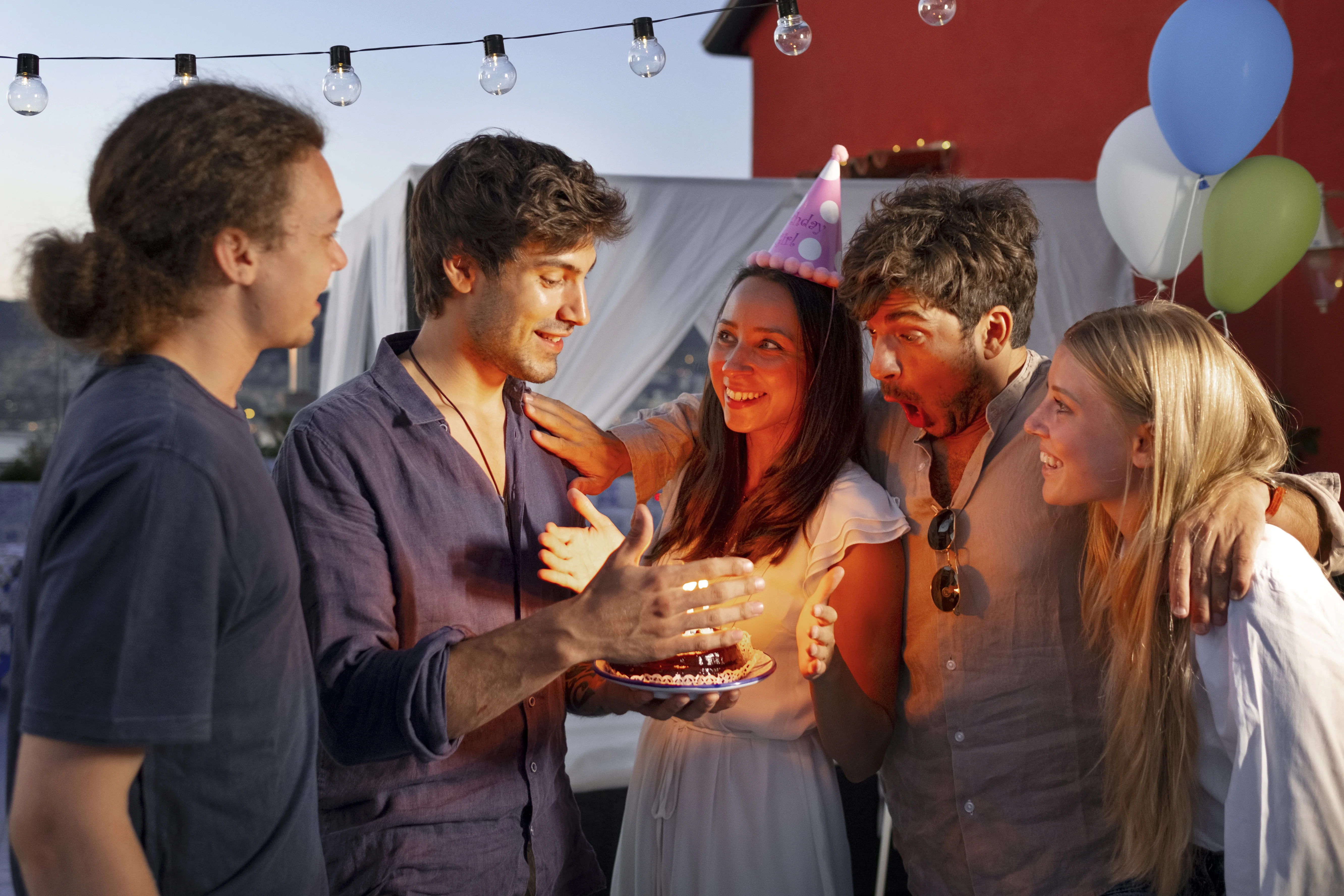 Teenagers celebrating 18th birthday with fun party decorations and vibrant atmosphere.