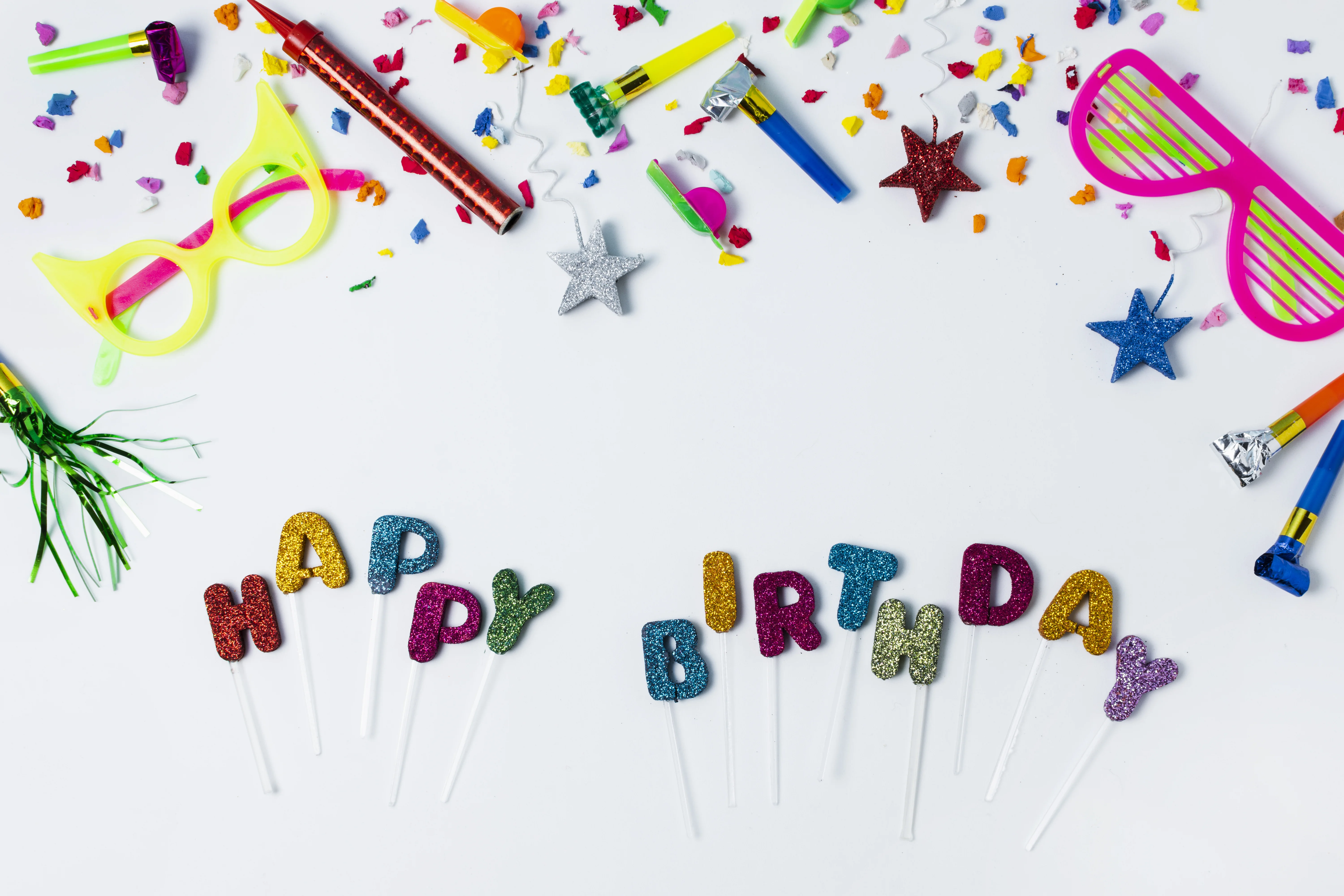 Colorful birthday party setup with balloons, cake, and decorations