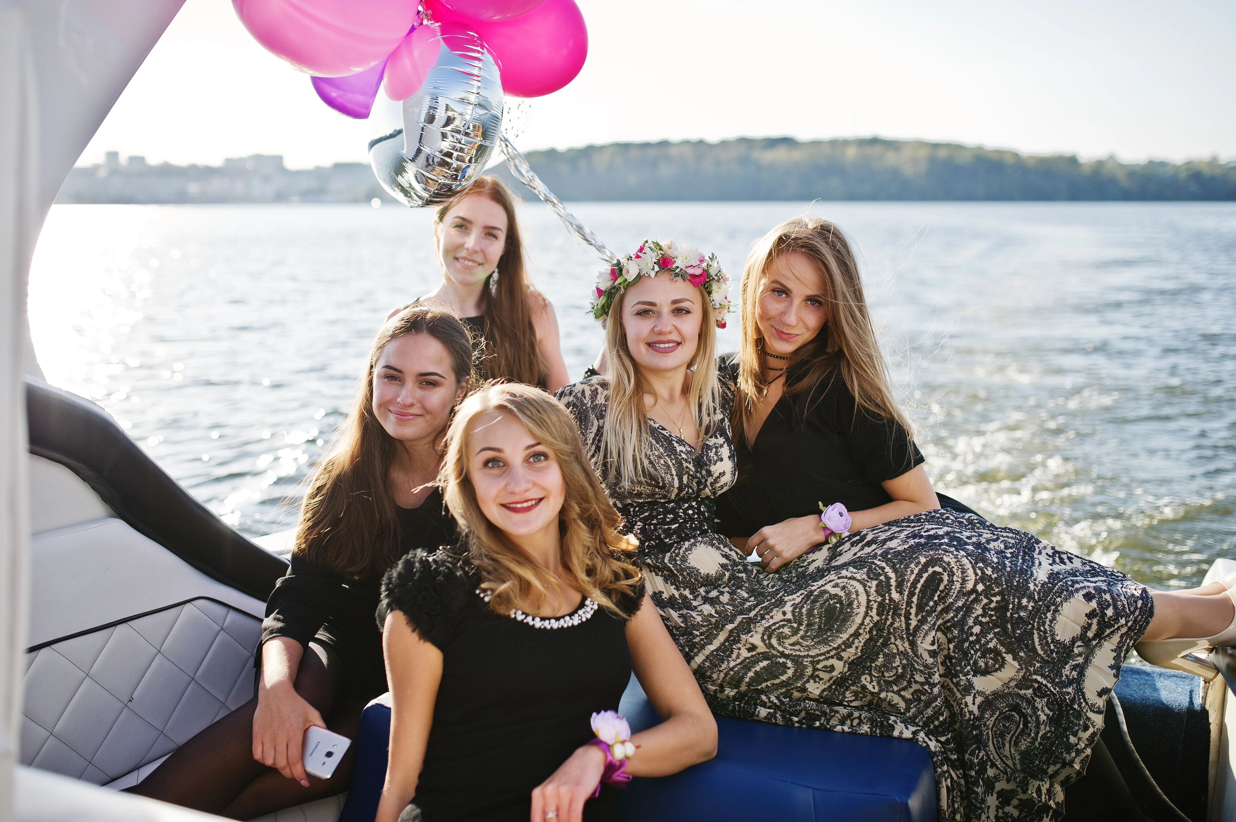 Group of women celebrating bachelorette party on San Antonio River Walk