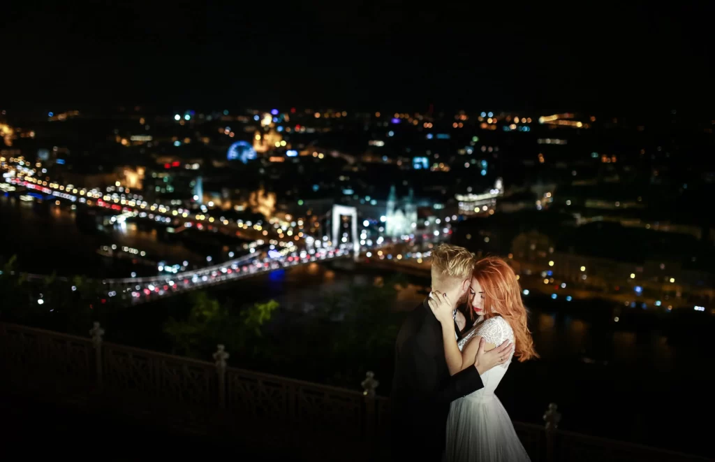 Rooftop wedding reception in Washington DC with string lights and skyline view