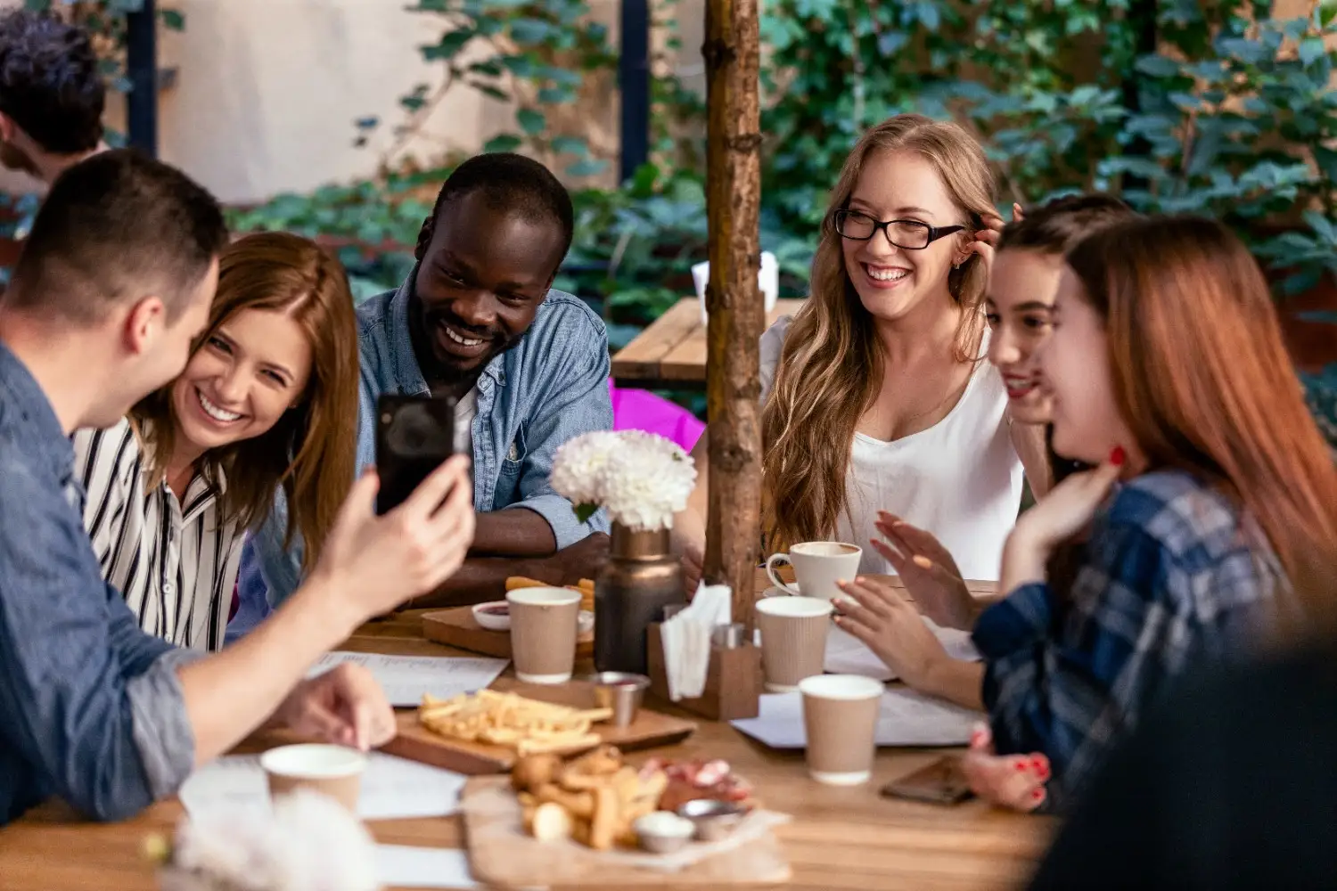 Diverse group of friends enjoying brunch on a rooftop in Washington DC