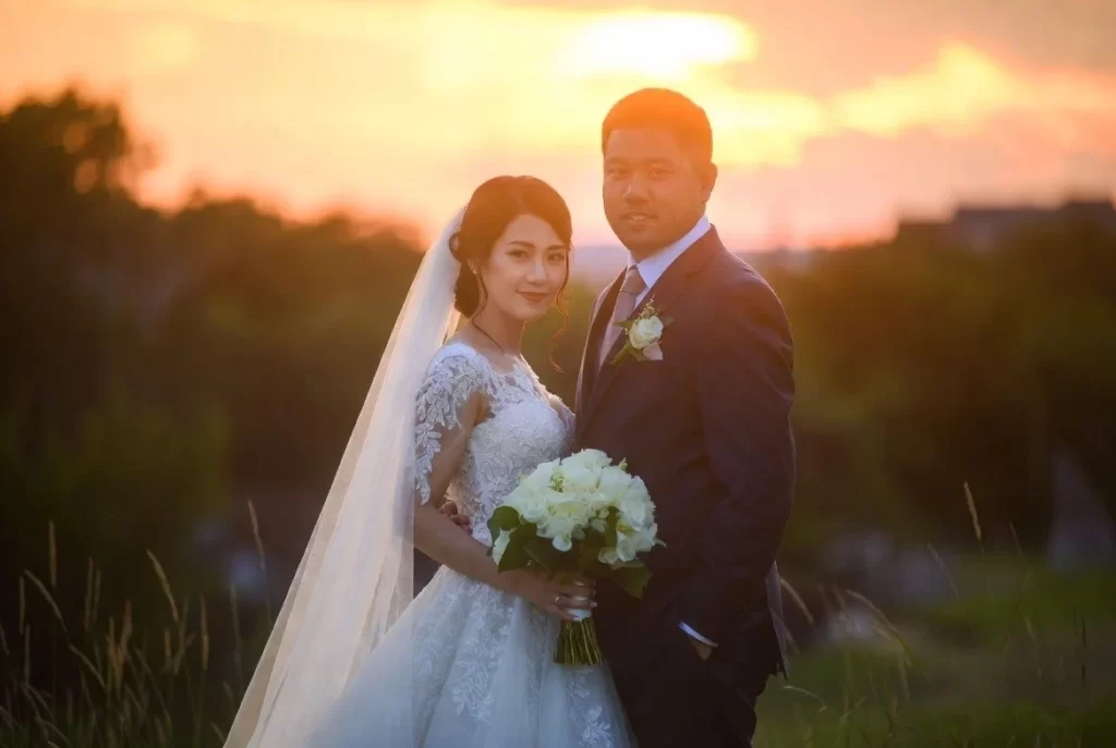 Wedding photographer capturing bride and groom