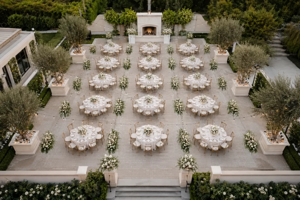 Outdoor banquet seating arrangement with round tables and wide guest aisles
